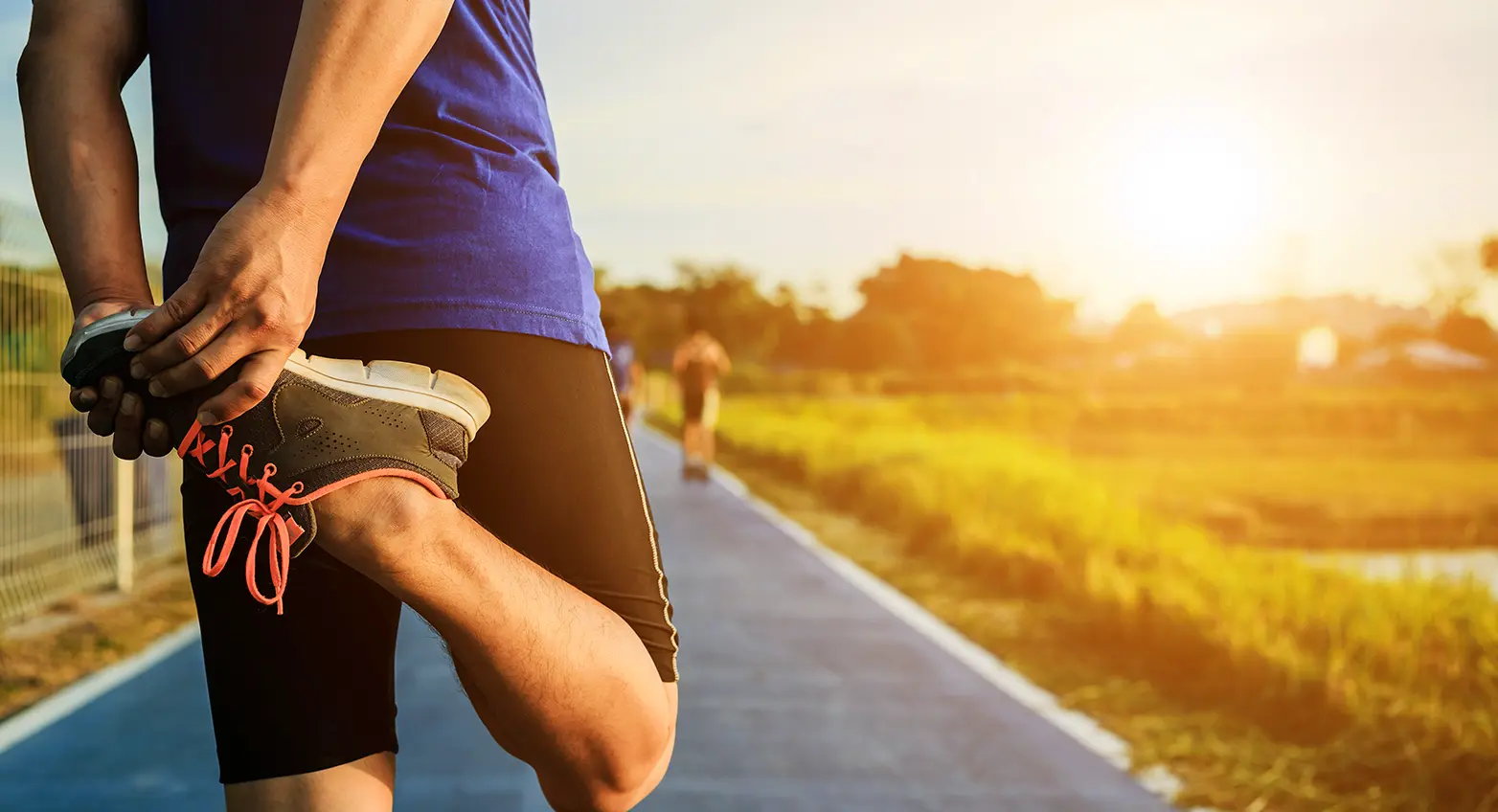 A runner warming up and stretching