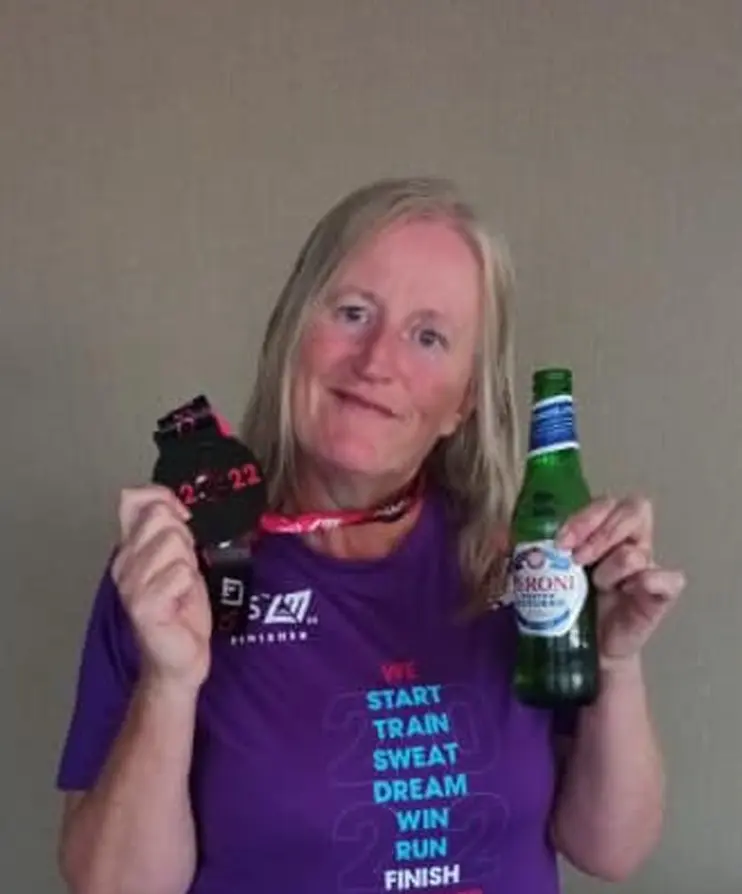 Janice finishes the London Marathon and collects a well earned medal